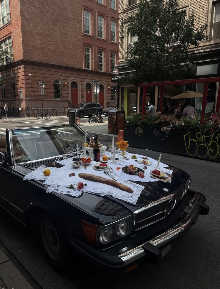 A picnic on a car bonnet