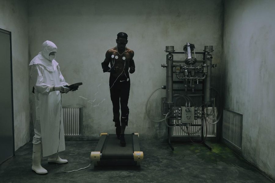 A runner wired up in a concrete lab