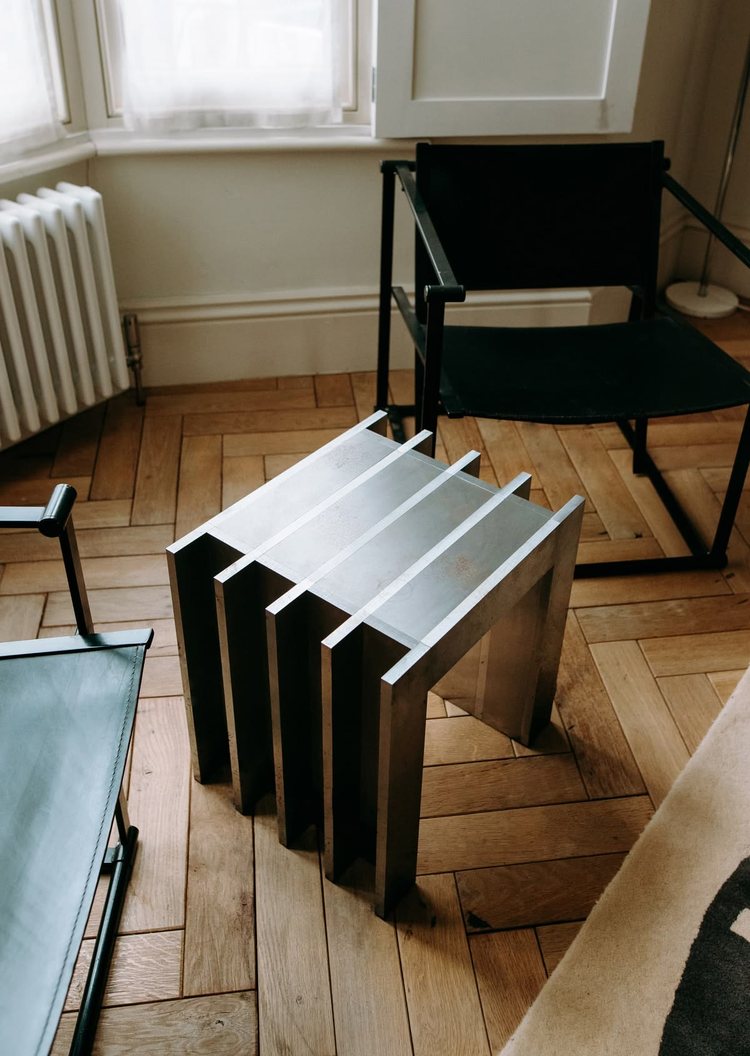 A saved aluminium stool