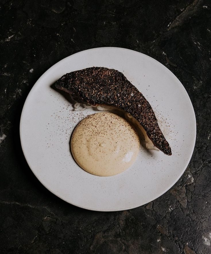 A plated dish on dark marble