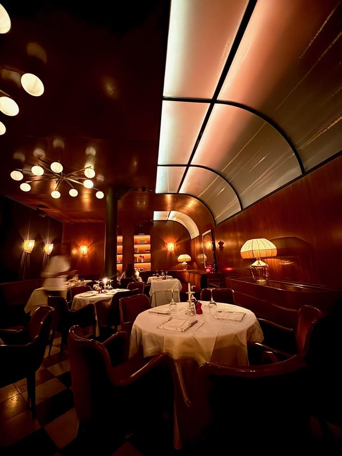 A warm wood-panelled dining room